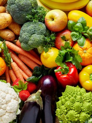 Different fruits and vegetables Different colorful fruits and vegetables all over the table in full frame studio shot